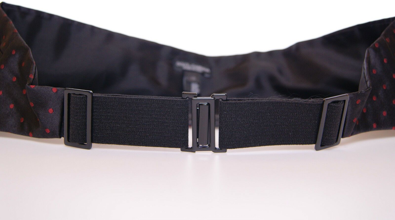 Dolce & Gabbana Eleganter schwarzer Kummerbund aus Seide mit roten Punkten