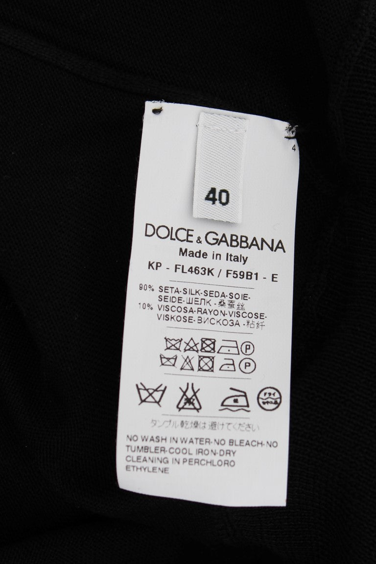Dolce & Gabbana Elegantes schwarzes Poloshirt aus Seide mit Blumenmuster