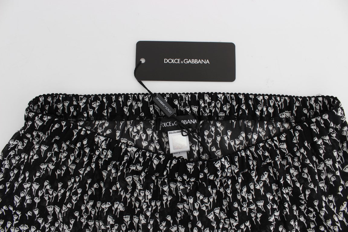 Dolce & Gabbana Elegante schwarz-weiße Shorts aus Seidenspitze mit Blumenmuster