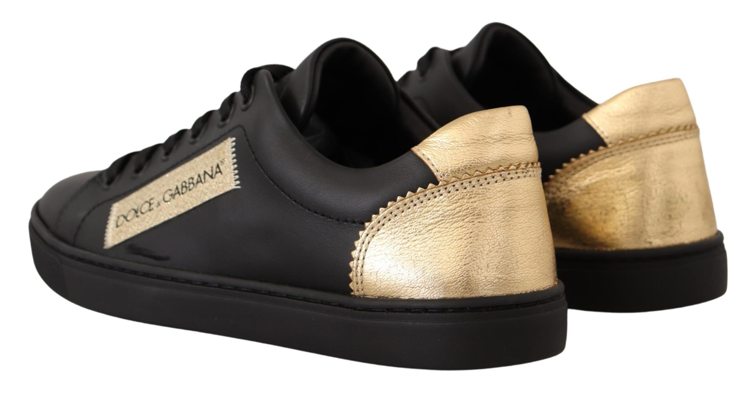 Dolce & Gabbana Schicke schwarze und goldene niedrige Ledersneaker