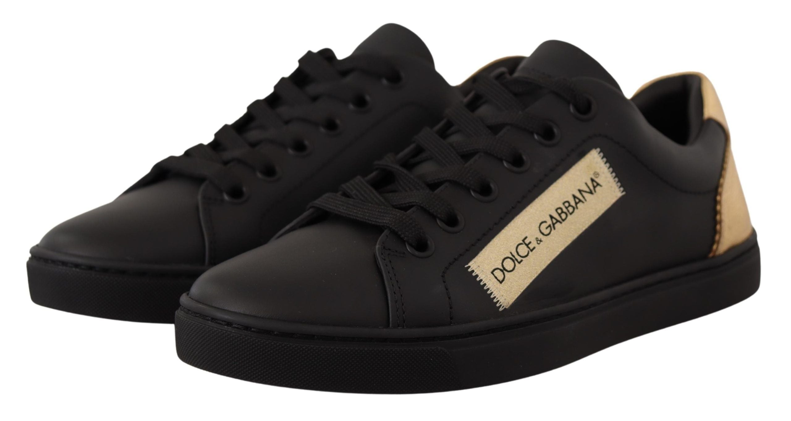 Dolce &amp; Gabbana Schicke schwarze und goldene niedrige Ledersneaker