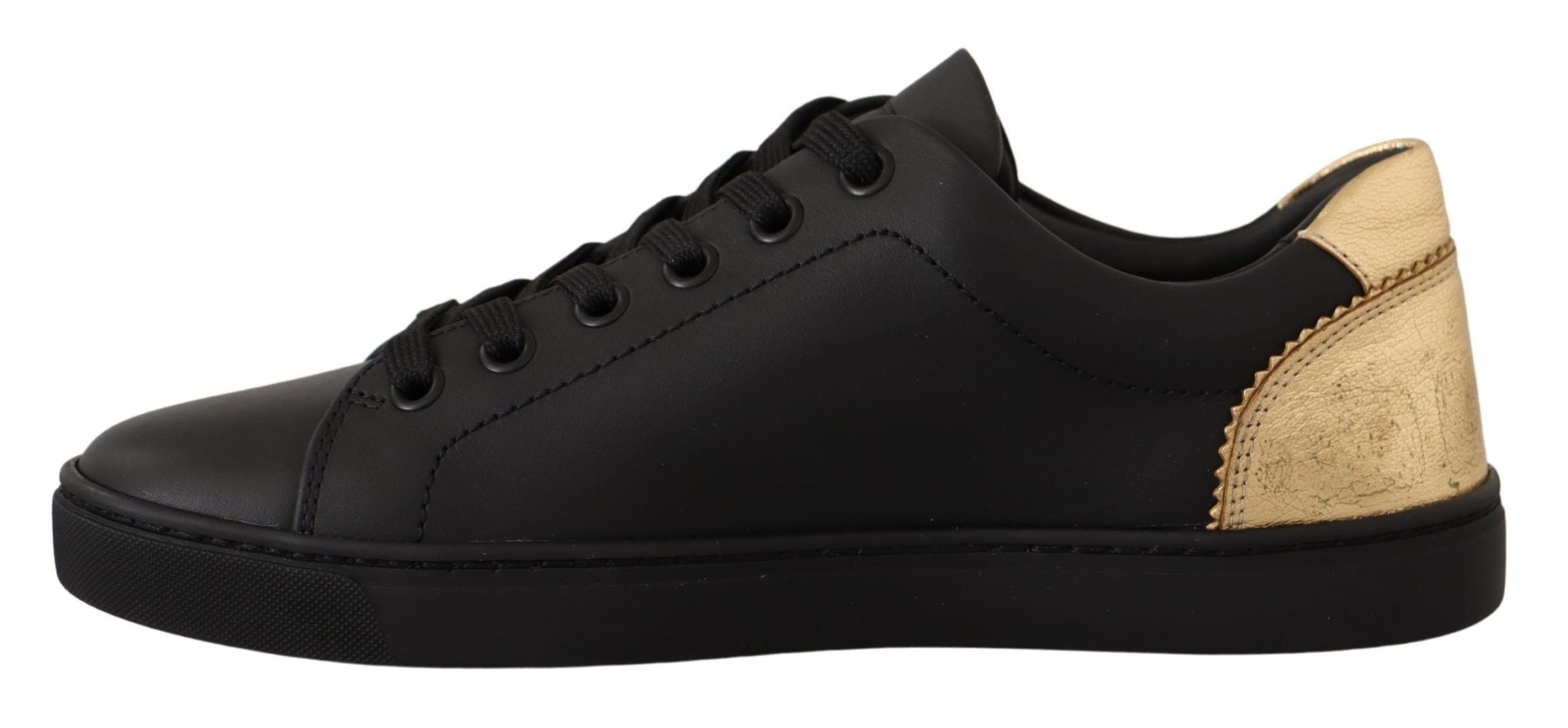 Dolce &amp; Gabbana Schicke schwarze und goldene niedrige Ledersneaker
