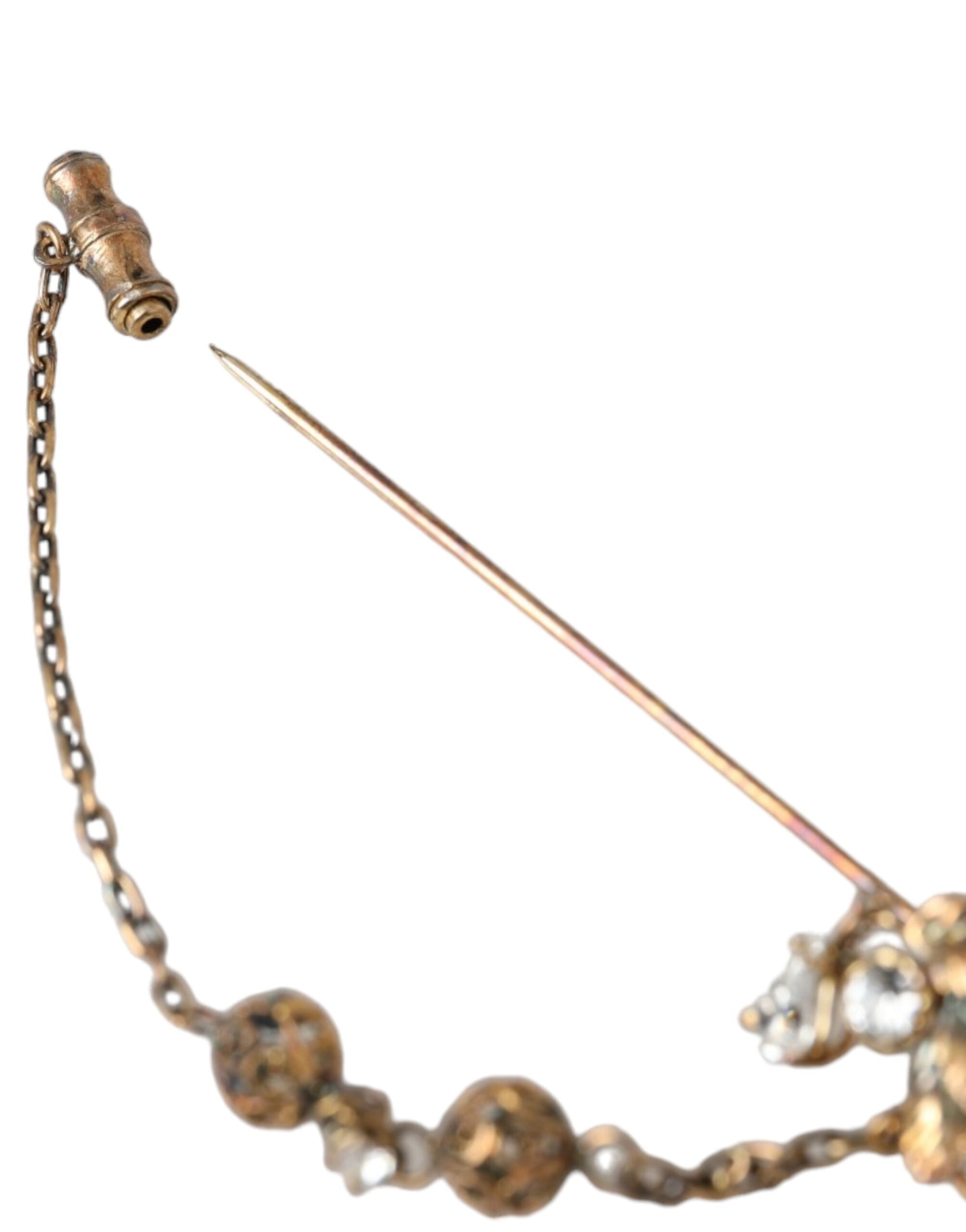 Dolce &amp; Gabbana Brosche aus vergoldetem Messing mit Kristallkette, 925er Sterlingsilber