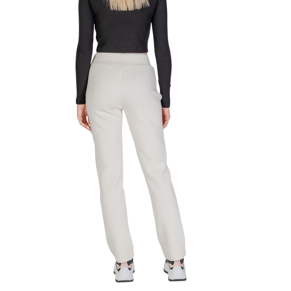 Blugi și pantaloni Guess Active din bumbac crem