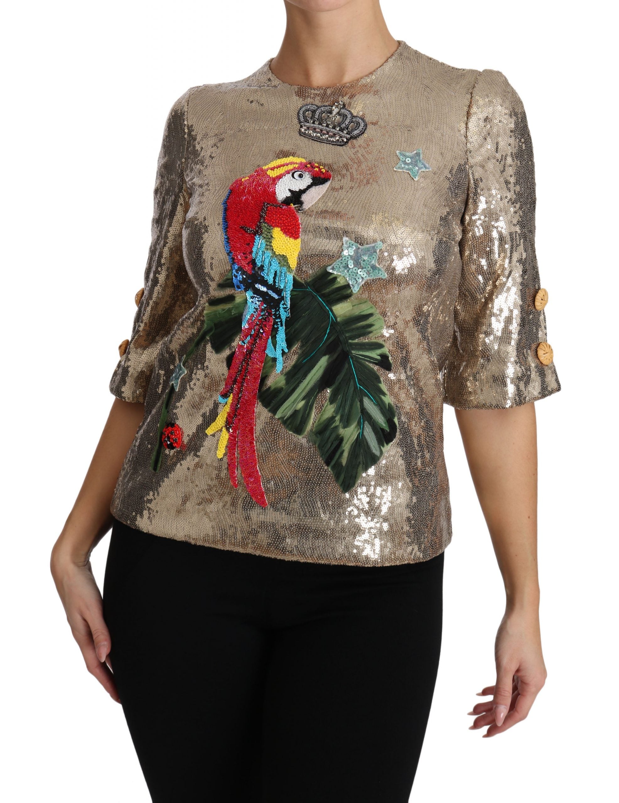 Dolce &amp; Gabbana – Rundhalsbluse mit goldenem Papageienmotiv und Kristallen
