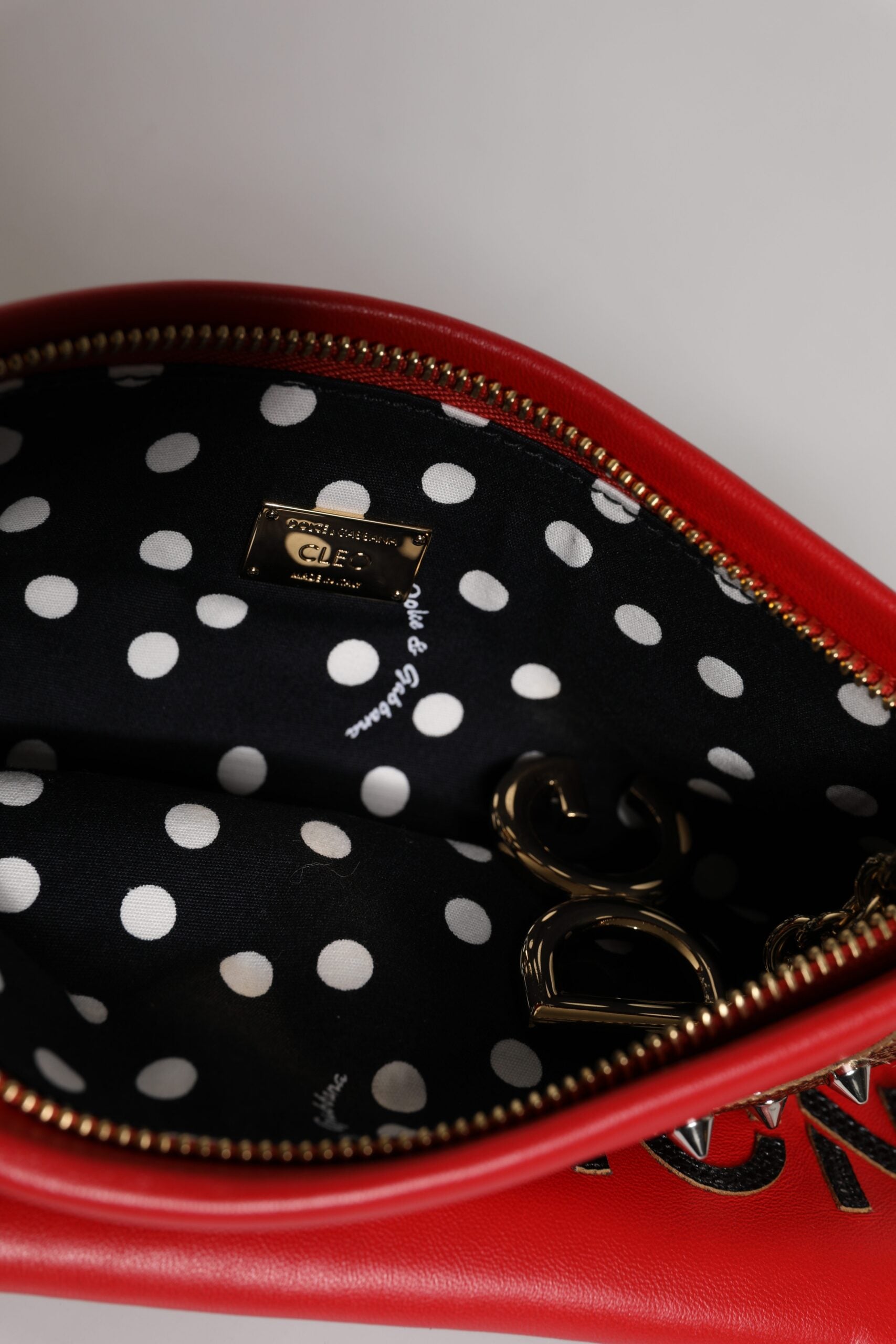 Dolce &amp; Gabbana – Rote Clutch aus verziertem Leder „Revolutions“